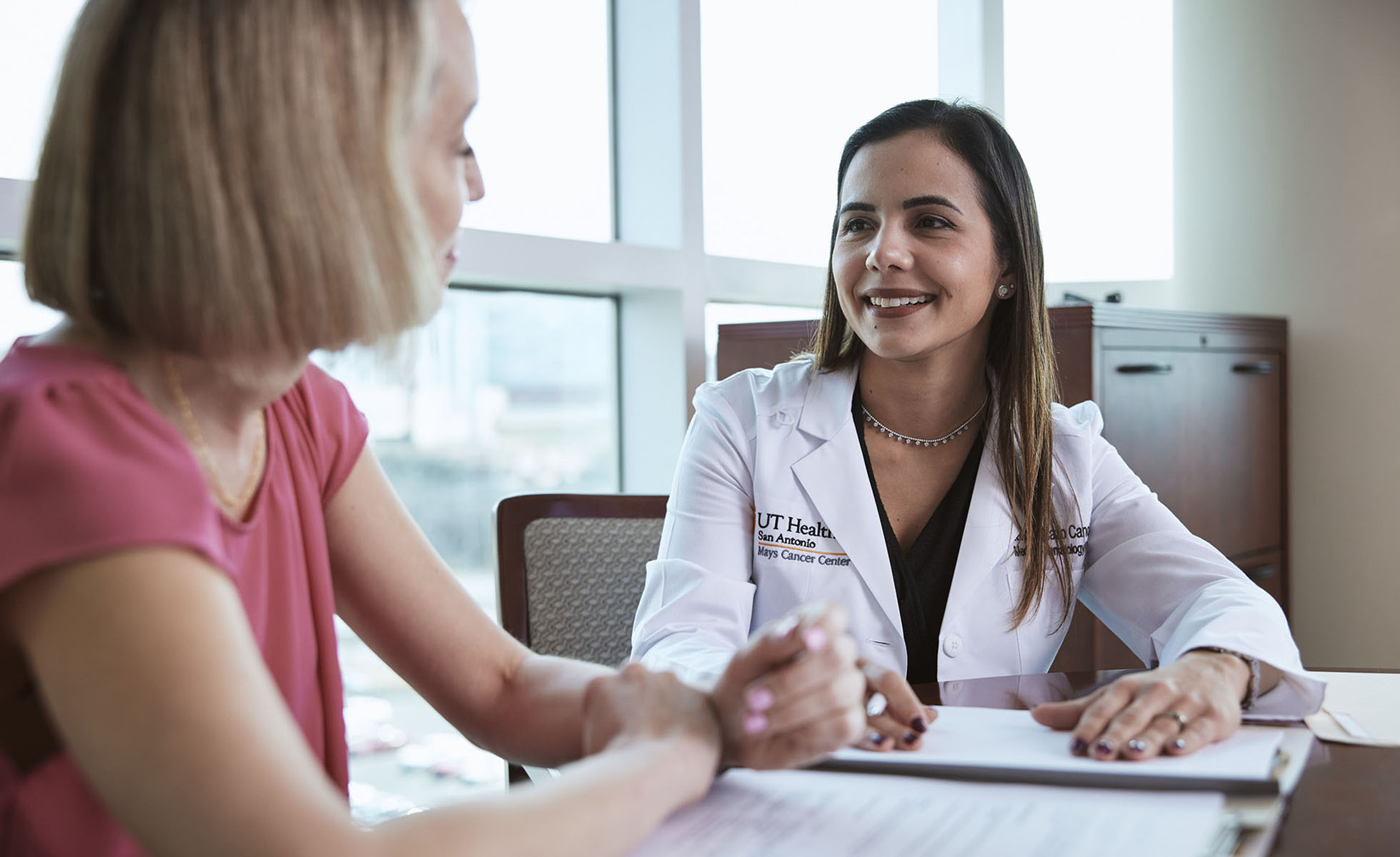 A doctor speaking with a patient 