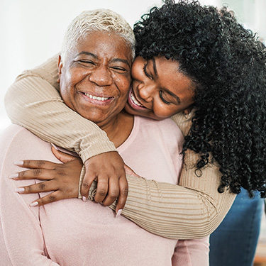 Mother and daughter hugging