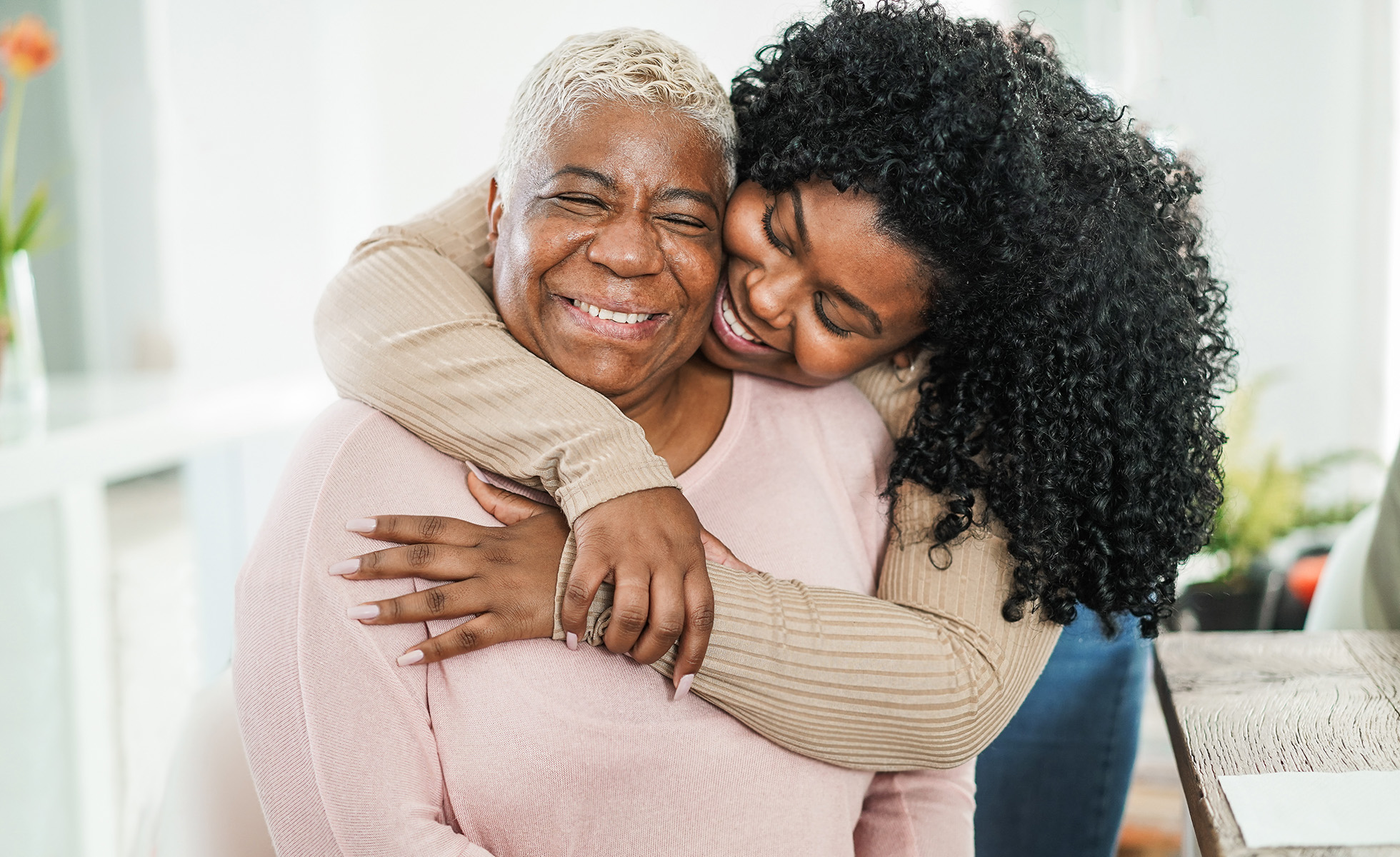 Mother and daughter hugging
