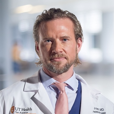 Dr. Fries in his white coat