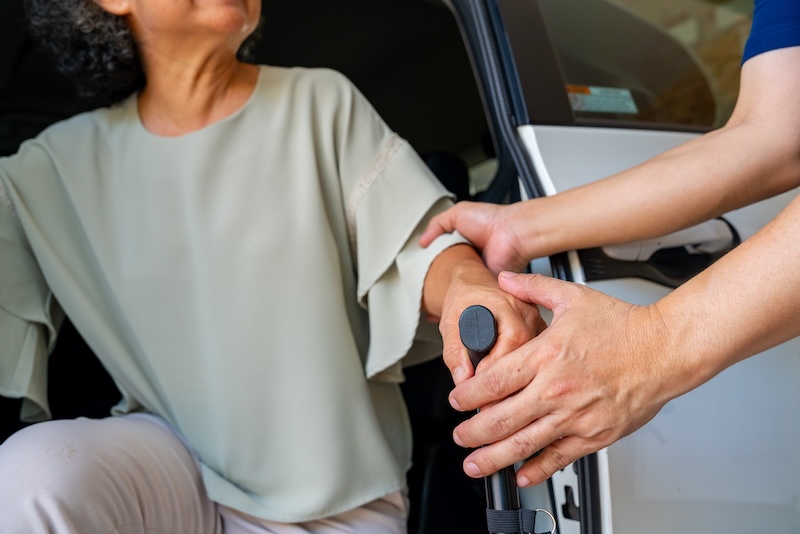 patient getting out of car, arriving to an appointment