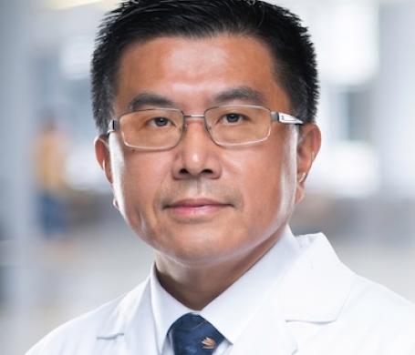 Dr. Zheng in a white coat